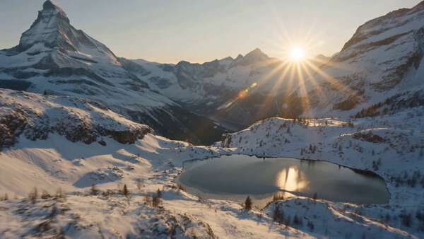 Sunrise Over Swiss Alps with Avalanche